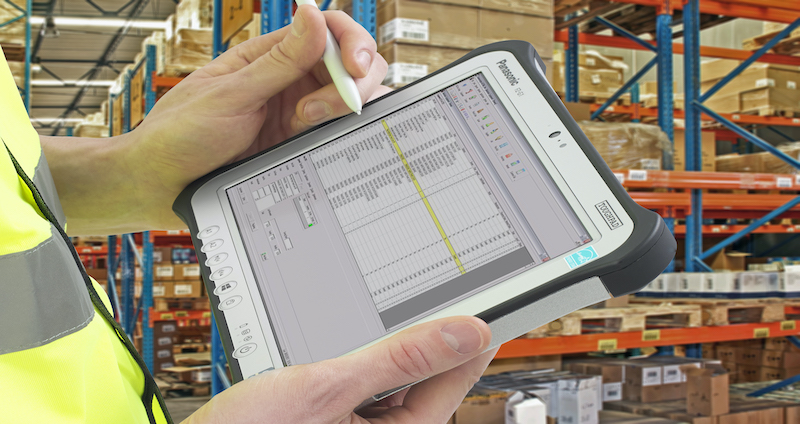 Warehouse worker using the Panasonic FZ-G1 to manage inventory in his warehouse. 