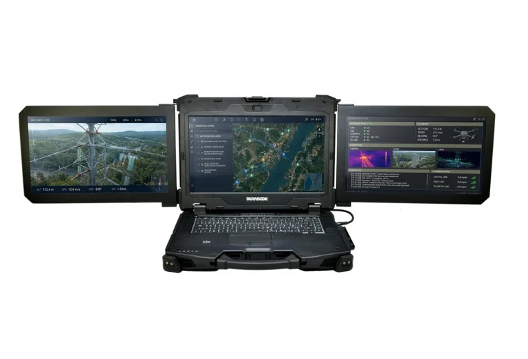 Durabook Z14I-DX3 rugged triple-screen mobile workstation open with three displays