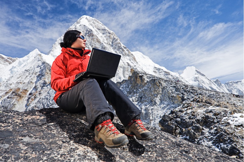 field worker with her rugged laptop to reduce the impact on environment