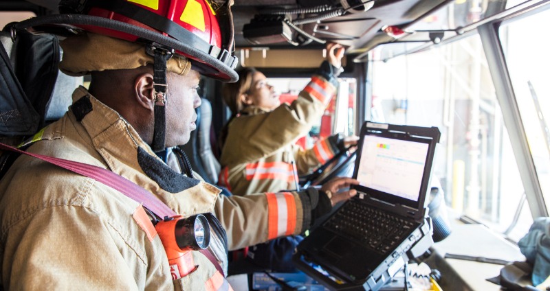 Fire Fighter using a fully rugged laptop